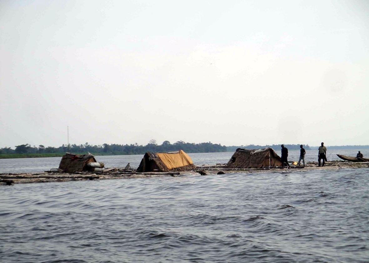 Logs bound together and floated downstream between Mbandaka and 