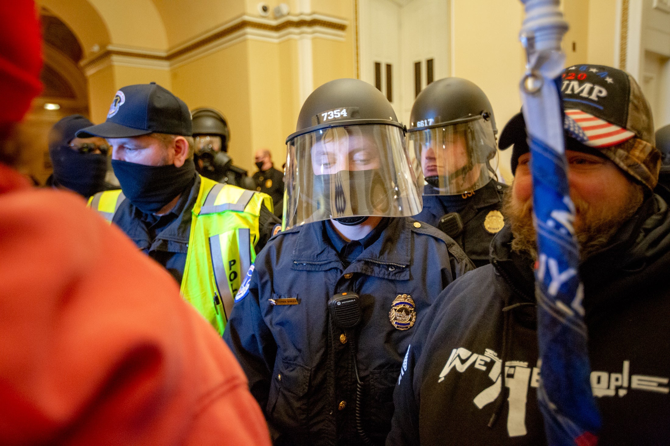 Police and rioters intermingled in the Capitol. 