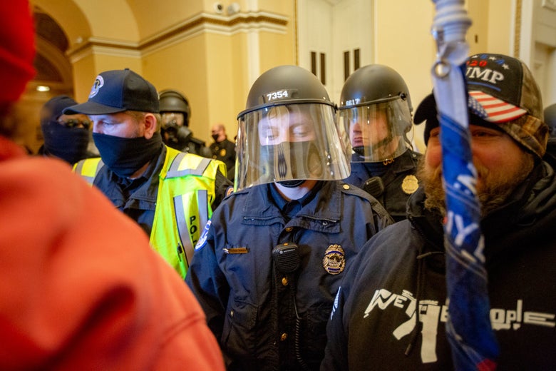 Police and rioters intermingled in the Capitol.