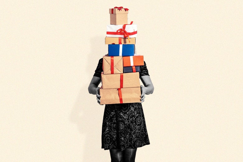 a woman carrying a pile of gifts
