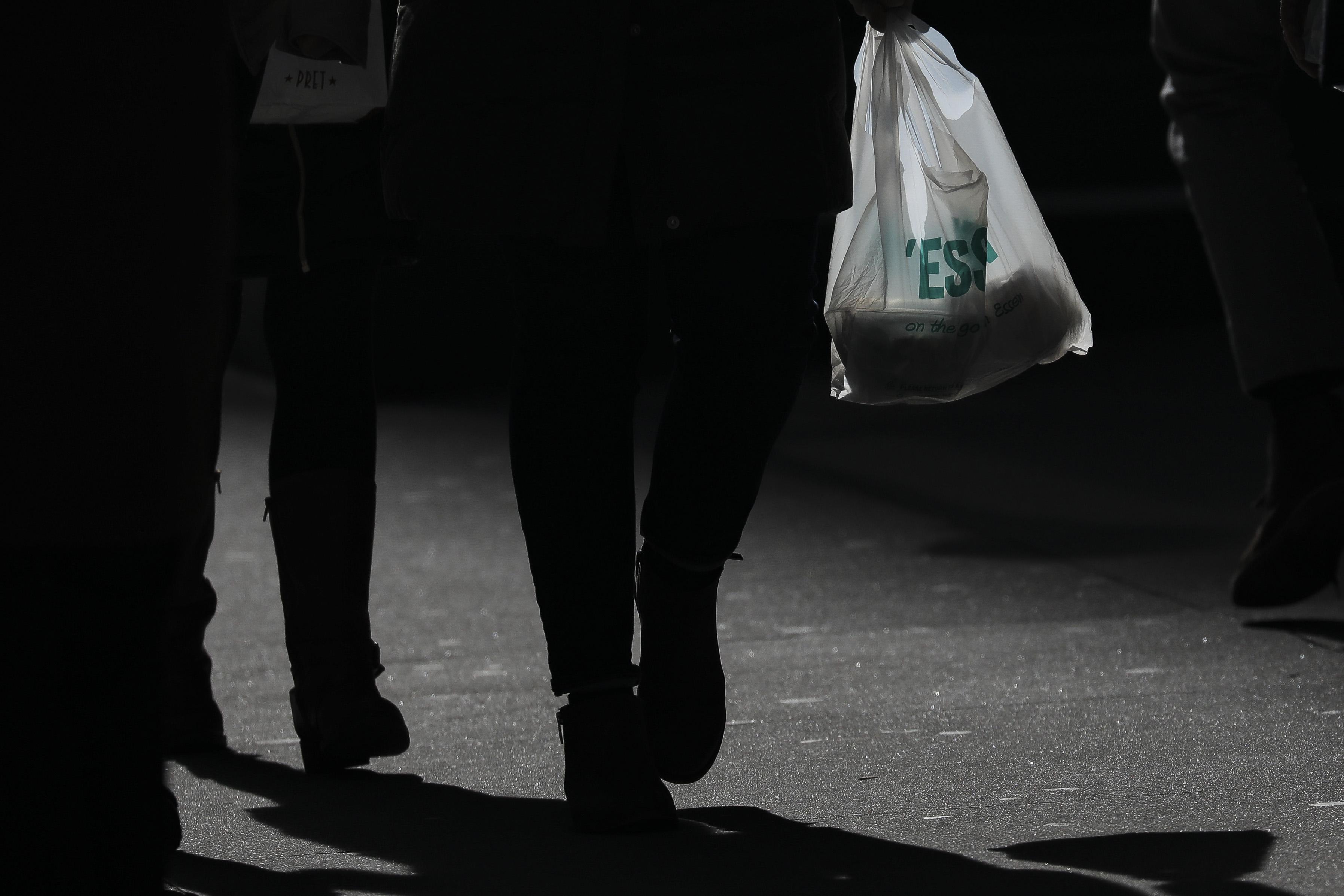A person carries a plastic bag during the lunch hour in Lower Manhattan, January 15, 2019 in New York City. 