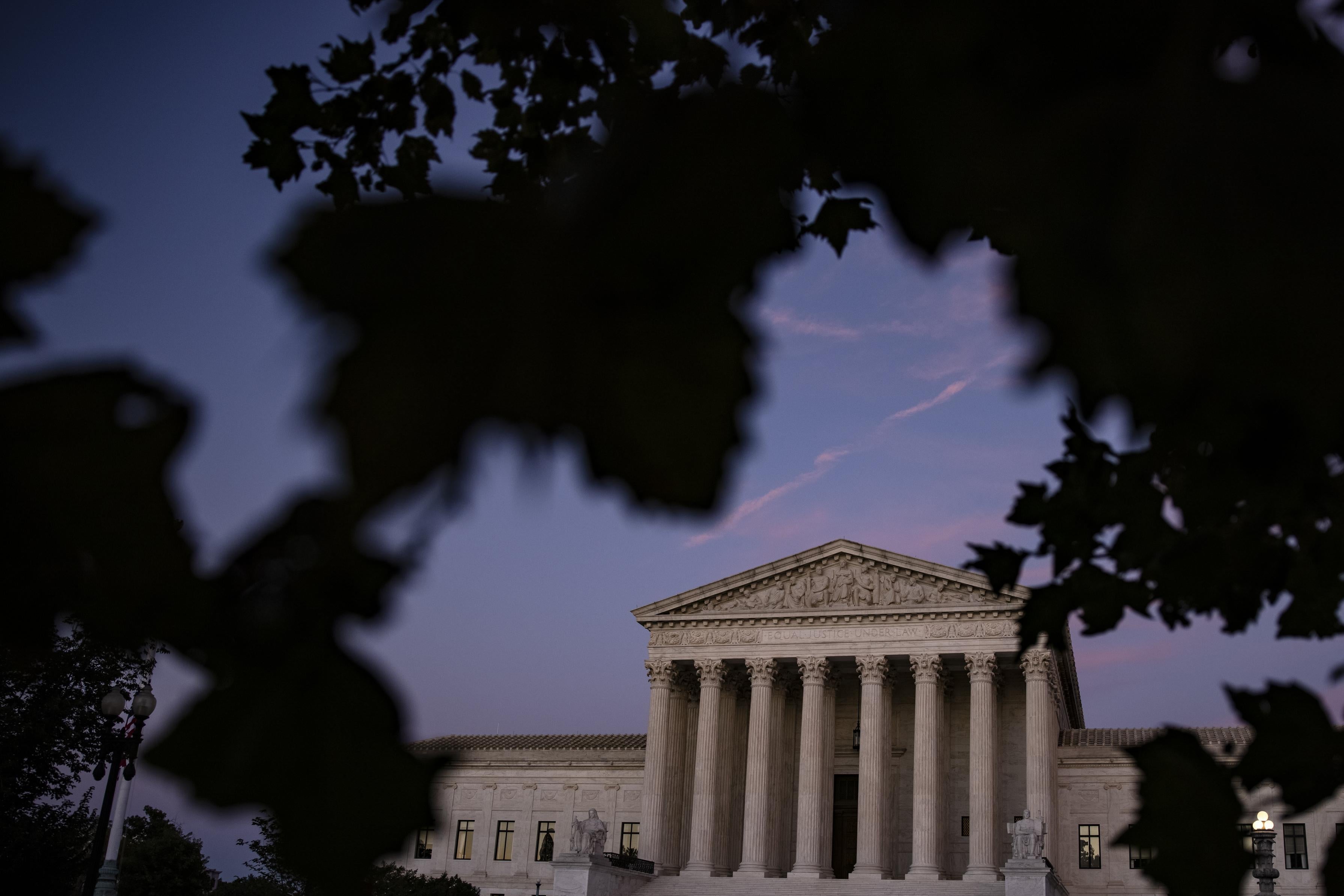 The Supreme Court building at sunset.