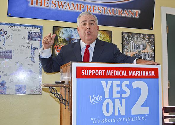 John Morgan speaks at a news conference during his "Yes on 2" campaign in favor of a proposed state constitutional amendment to allow medical marijuana, in Gainesville, Florida, on Sept. 26, 2014