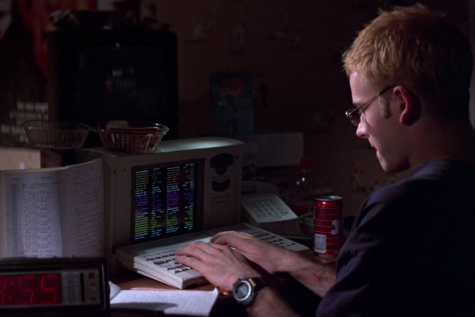 Screengrab from Hackers of someone writing code on a computer.