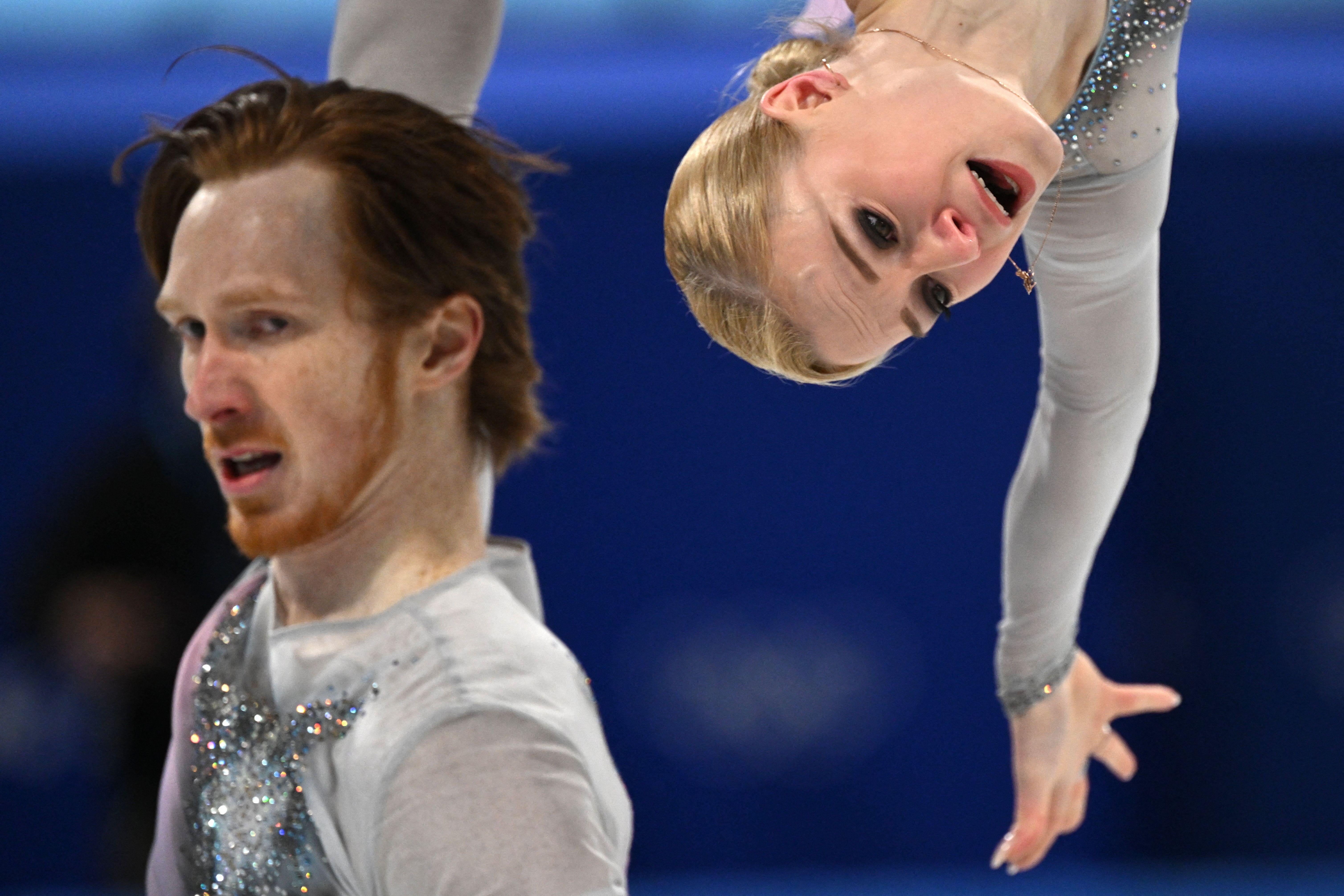 Morozov flipping Tarasova behind his back, Tarasova upside down