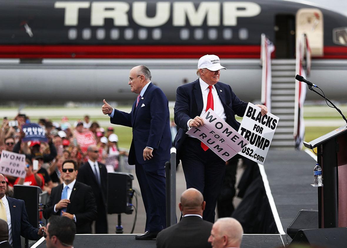 Republican presidential candidate Donald Trump and former New York City mayor Rudy Giuliani campaign together during a rally at the Lakeland Linder Regional Airport on October 12, 2016 in Lakeland, Florida. 
