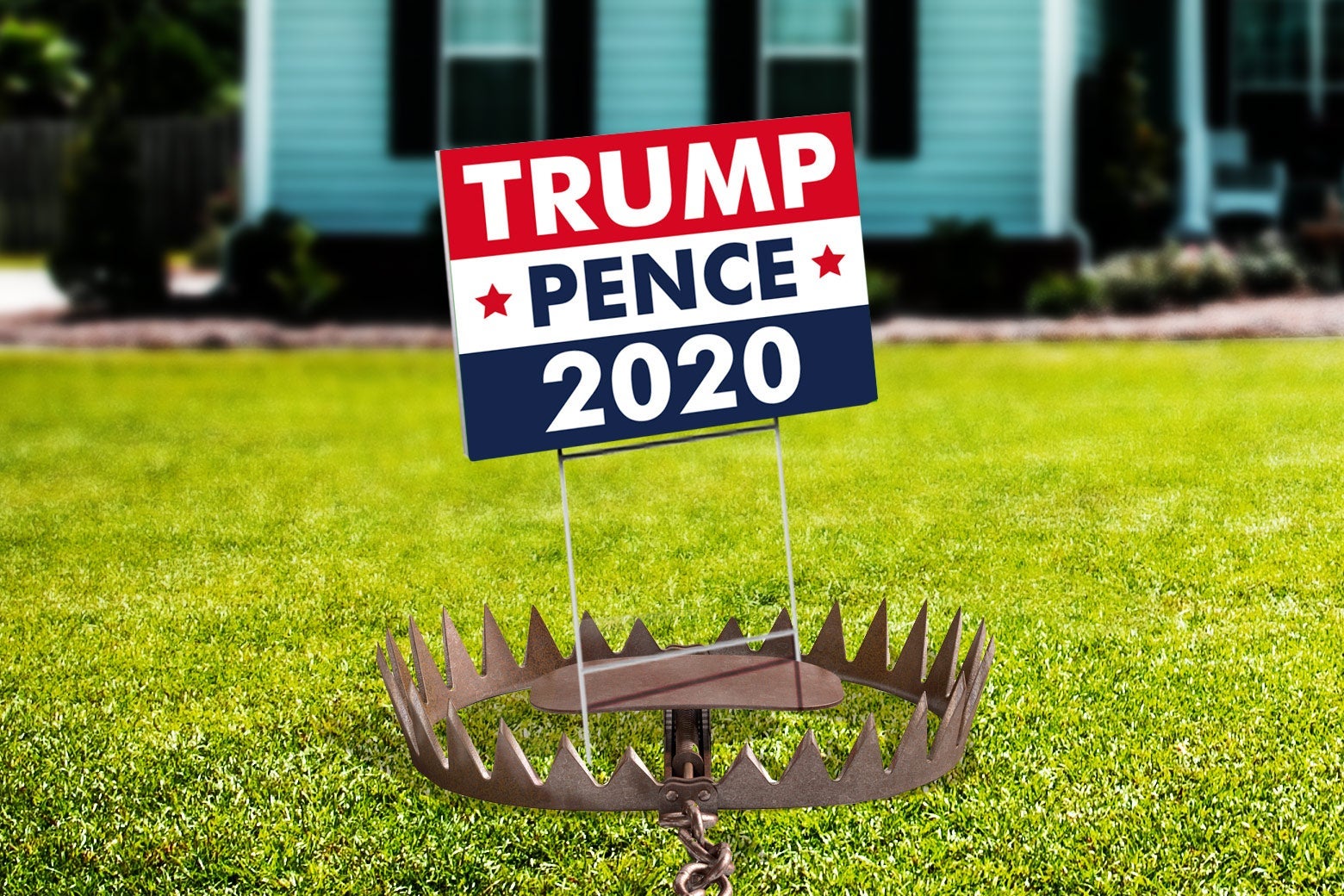 A Trump-Pence 2020 sign is seen on a lawn, with a spiked trap attached to it.