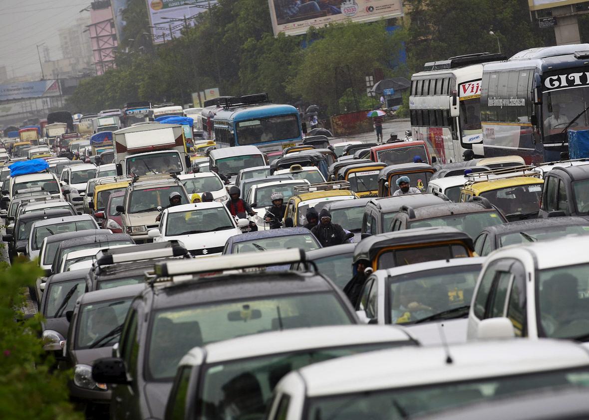 Vehicles are stuck in a traffic jam during heavy rains in Mumbai, India.