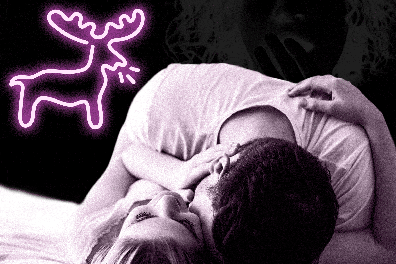 A couple cuddling on a bed with a neon deer in the background.