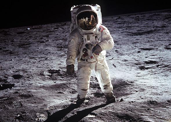 Astronaut Buzz Aldrin, lunar module pilot, walks on the surface of the Moon near the leg of the Lunar Module (LM) "Eagle" during the Apollo 11 extravehicular activity (EVA). Astronaut Neil A. Armstrong, commander, took this photograph.
