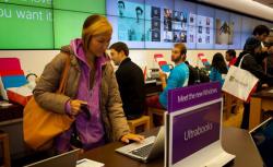A customer at the Microsoft Store tests out new Windows 8 devices in Seattle, Oct. 26, 2012. 