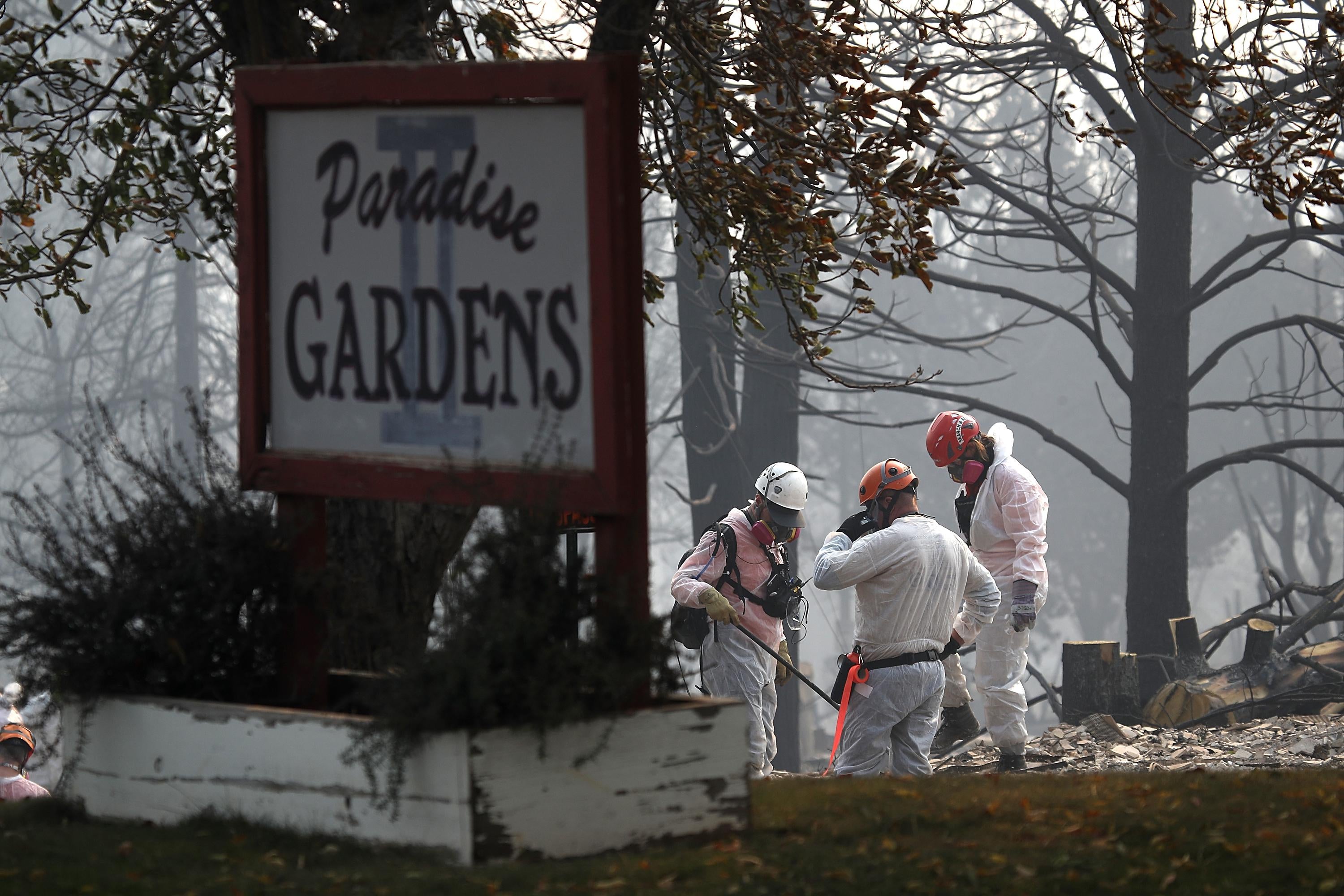 Rescue workers search the Paradise Gardens Apartments for victims of the Camp Fire.