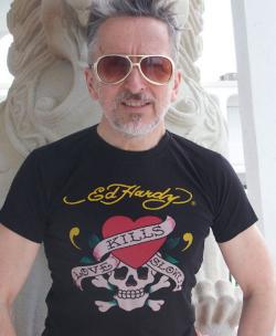 Simon Doonan in an Ed Hardy Love Kills tattoo t-shirt.