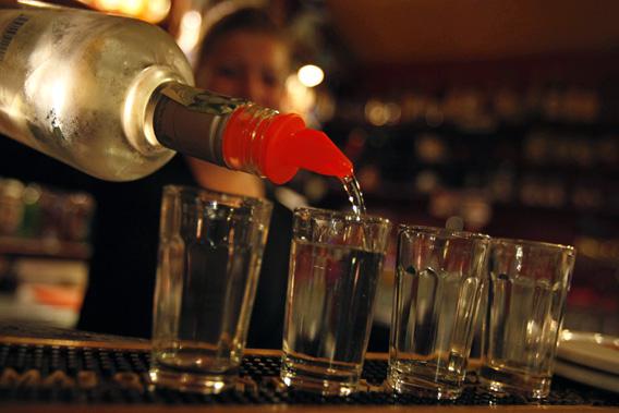 A bartender serves alcohol at a bar in Prague September 12, 2012.