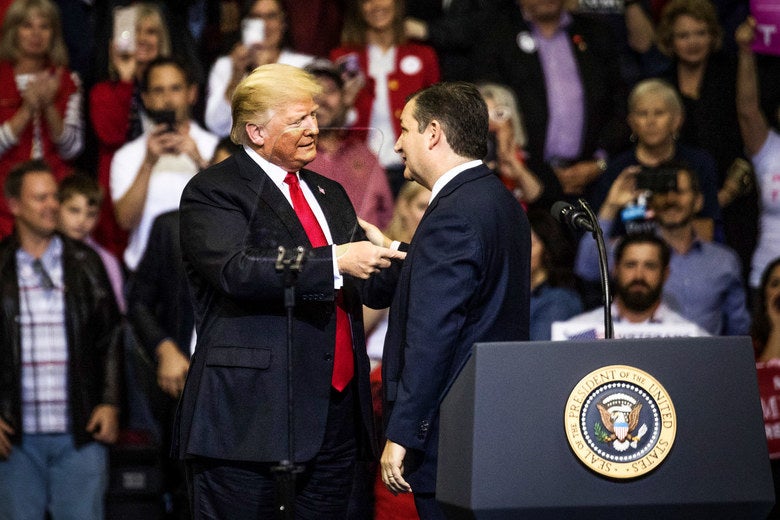 Donald Trump shaking hands with Ted Cruz on stage.