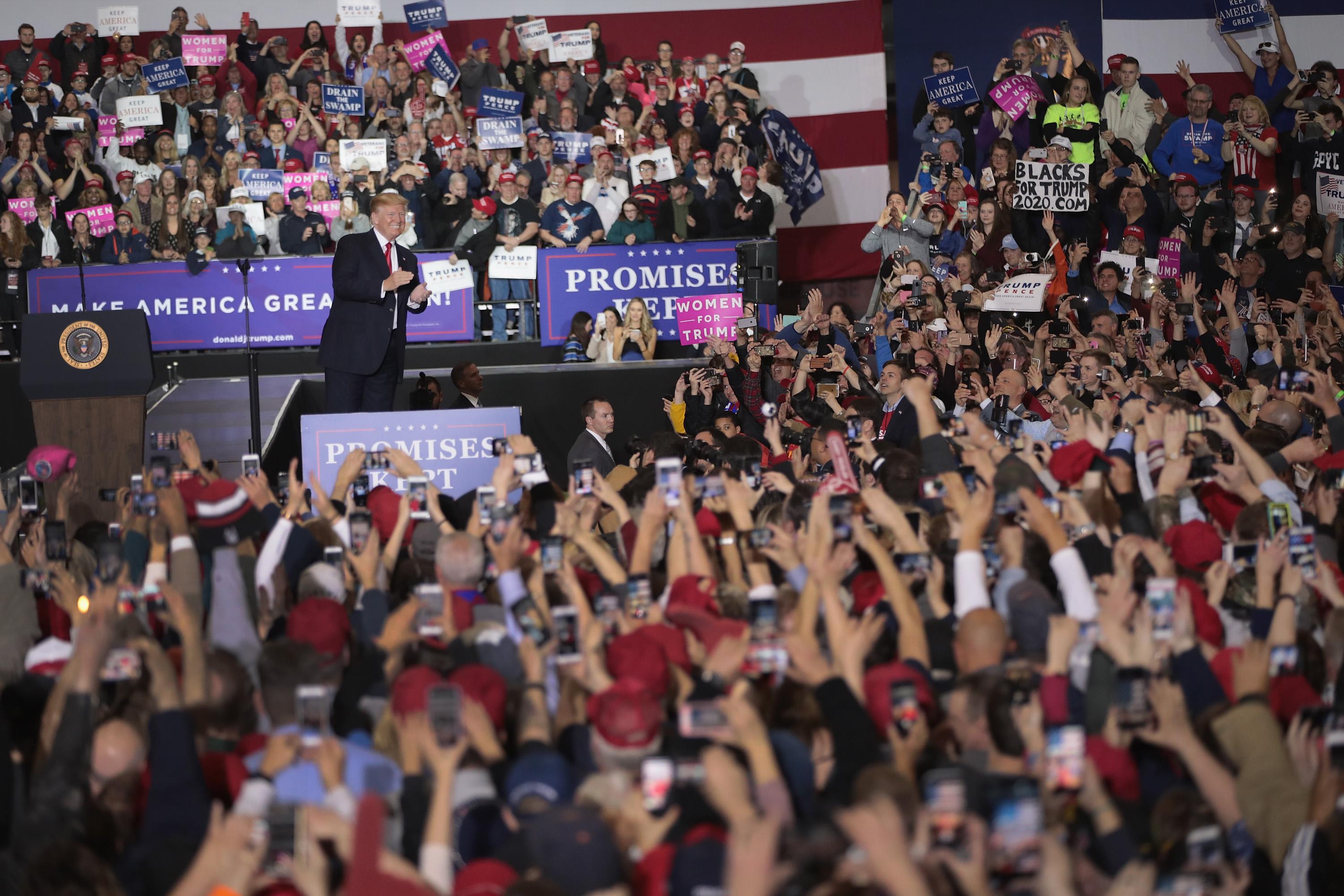 President Donald Trump speaks greets supporters during a campaign rally on April 28, 2018 in Washington, Michigan. 