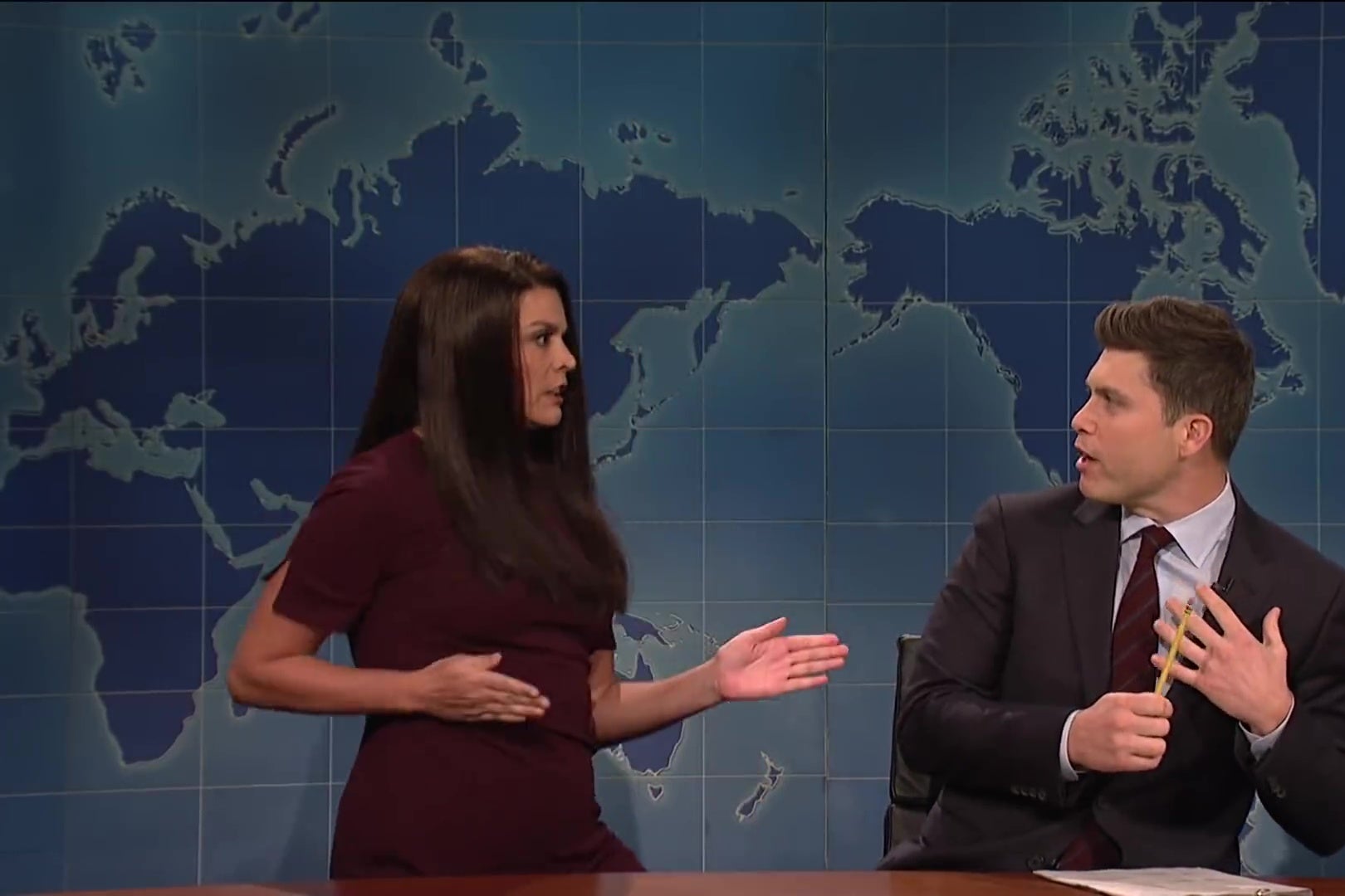 Cecily Strong strikes a karate pose as Colin Jost recoils in terror.
