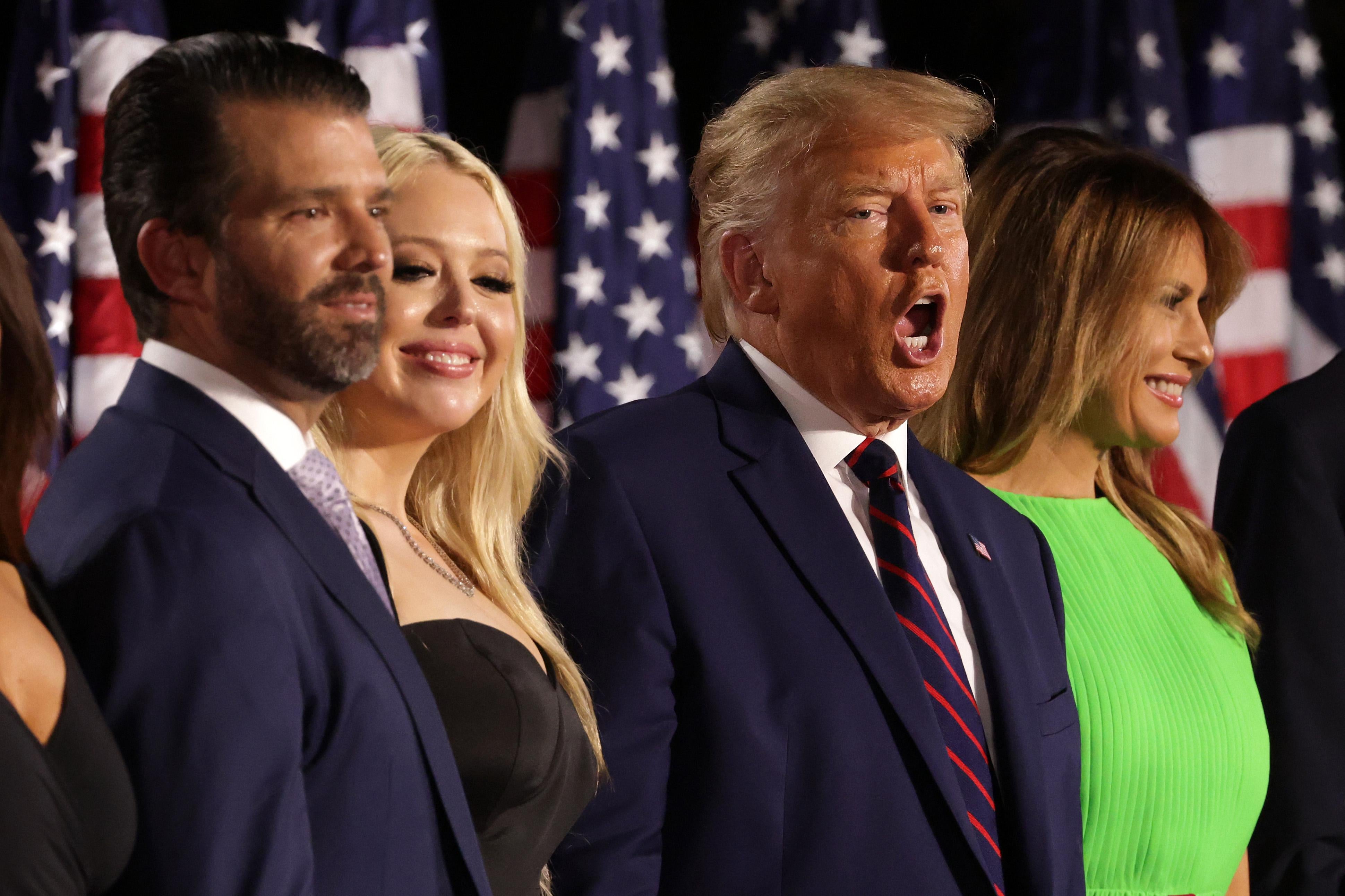Donald Trump stands mouth open with Melania, Don, Jr., and Tiffany Trump.