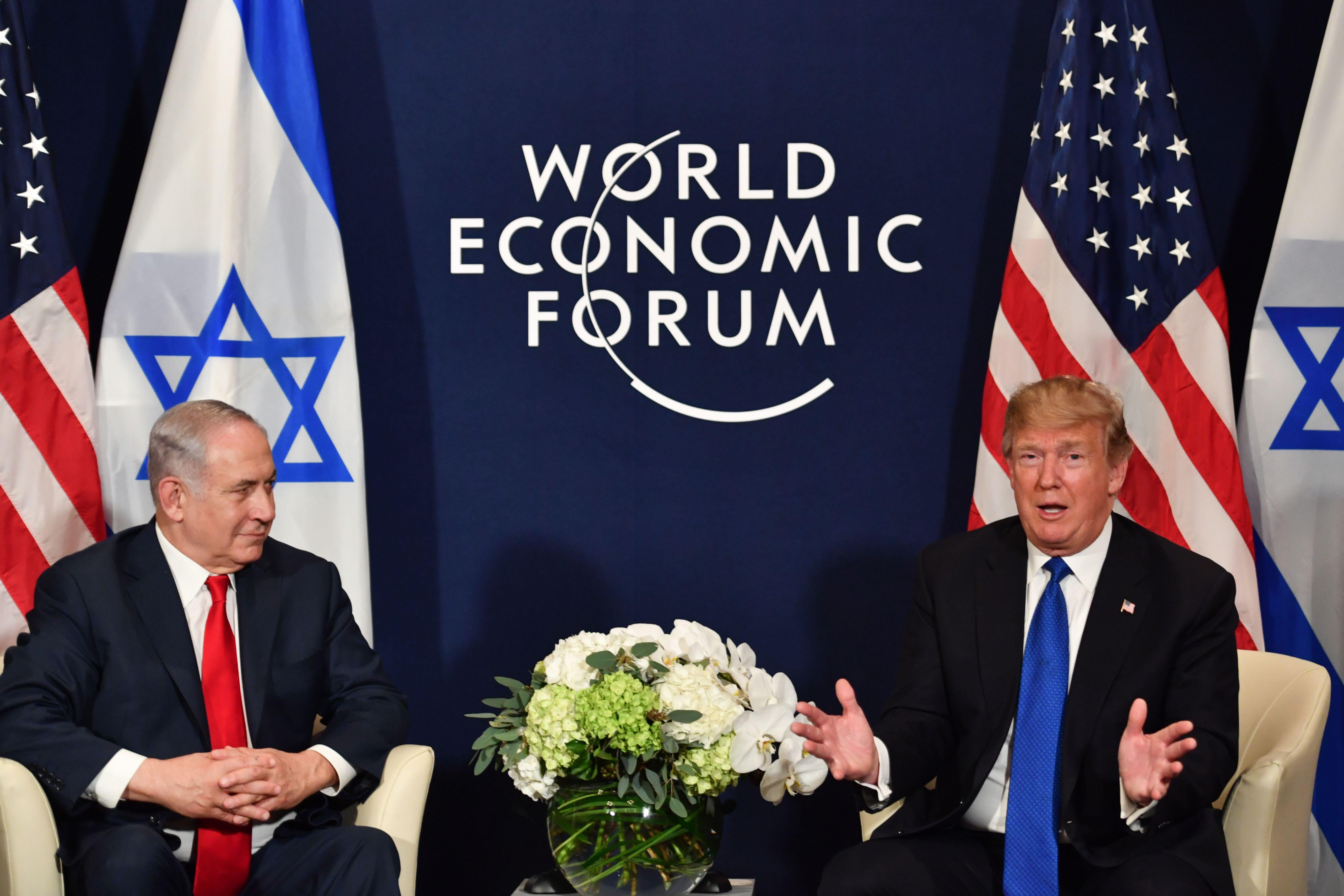 U.S. President Donald Trump (R) speaks with Israel's Prime Minister Benjamin Netanyahu during a bilateral meeting on the sidelines of the World Economic Forum (WEF) annual meeting in Davos, eastern Switzerland, on January 25, 2018. / AFP PHOTO / Nicholas Kamm        (Photo credit should read NICHOLAS KAMM/AFP/Getty Images)