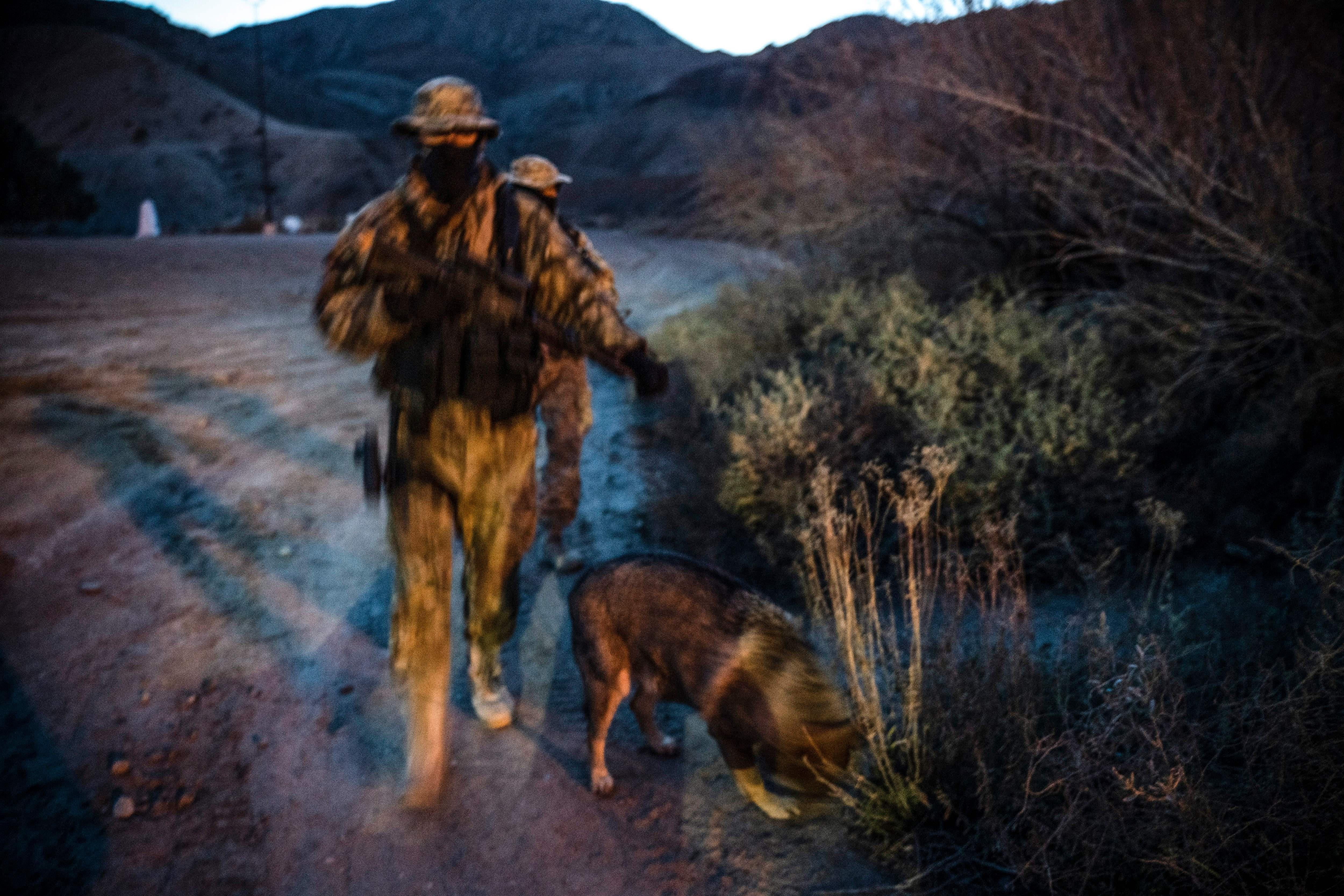 Members of the Constitutional Patriots New Mexico Border Ops Team militia, Viper and Stinger who go by aliases to protect their identity, patrol the US-Mexico border in Sunland Park, New Mexico on March 20, 2019. 