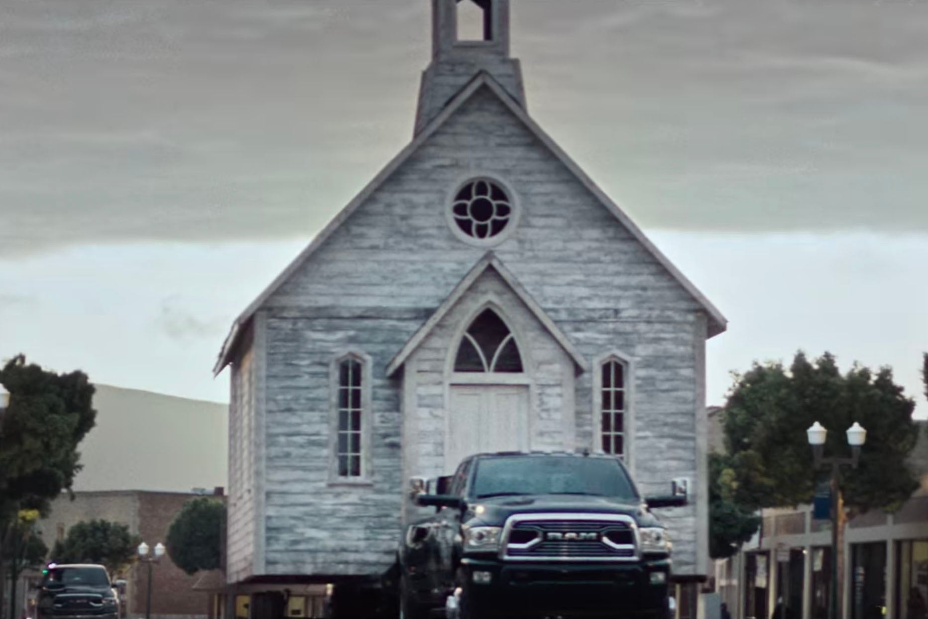 A Ram truck pulling a church.