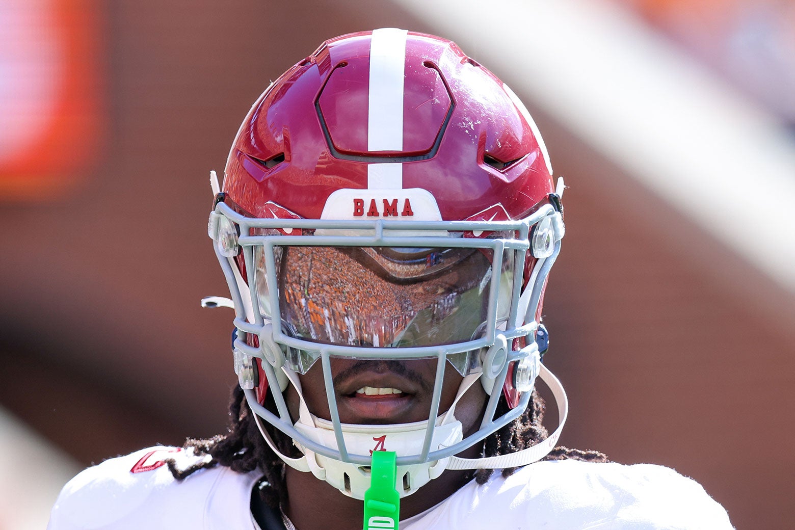 Lawson facing the camera with his helmet on, from the shoulders up.