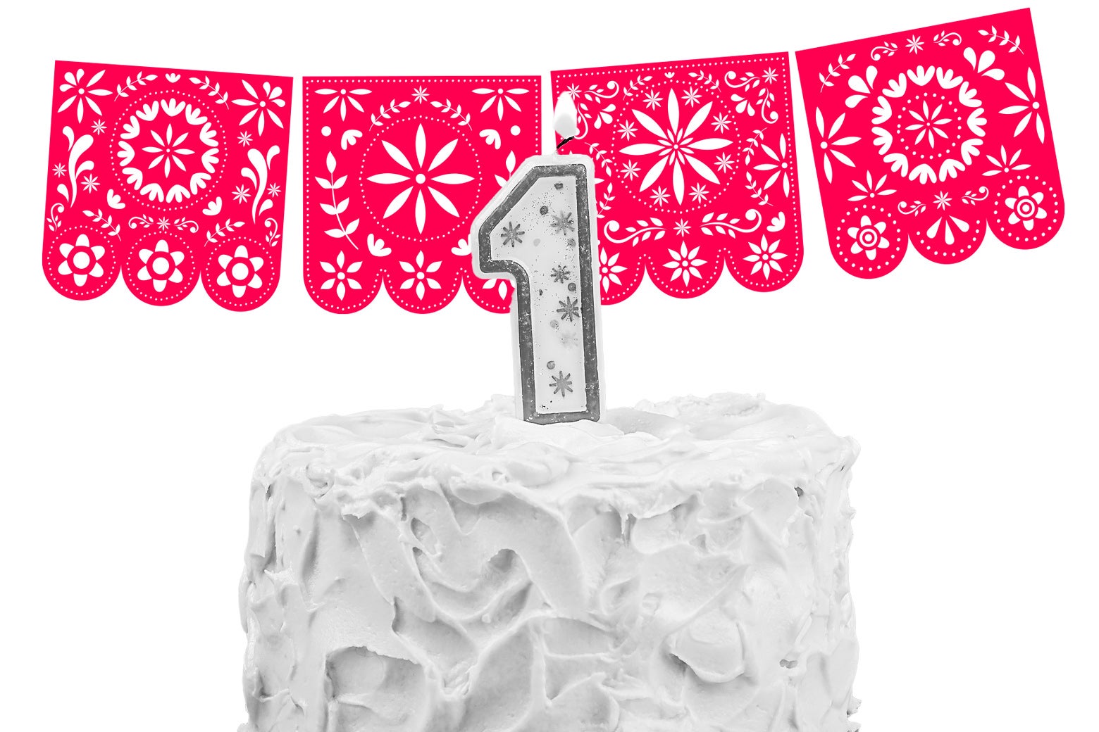 A cake with a 1 candle on it and Mexican paper decorations hanging above