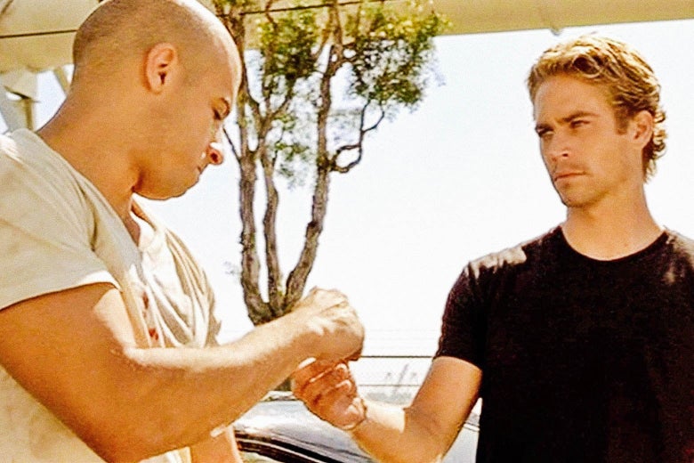 Vin Diesel and Paul Walker in a still image from the Fast and Furious series.