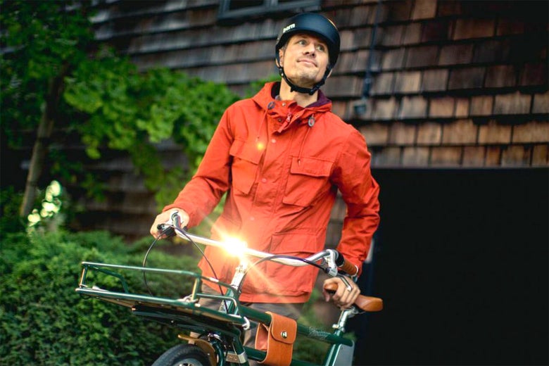 A man rides the Faraday Porteur e-bike. 