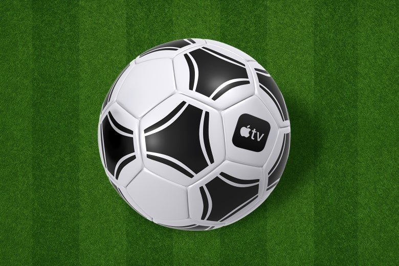 A large soccer ball in a field. The Apple TV logo is on the soccer ball. 