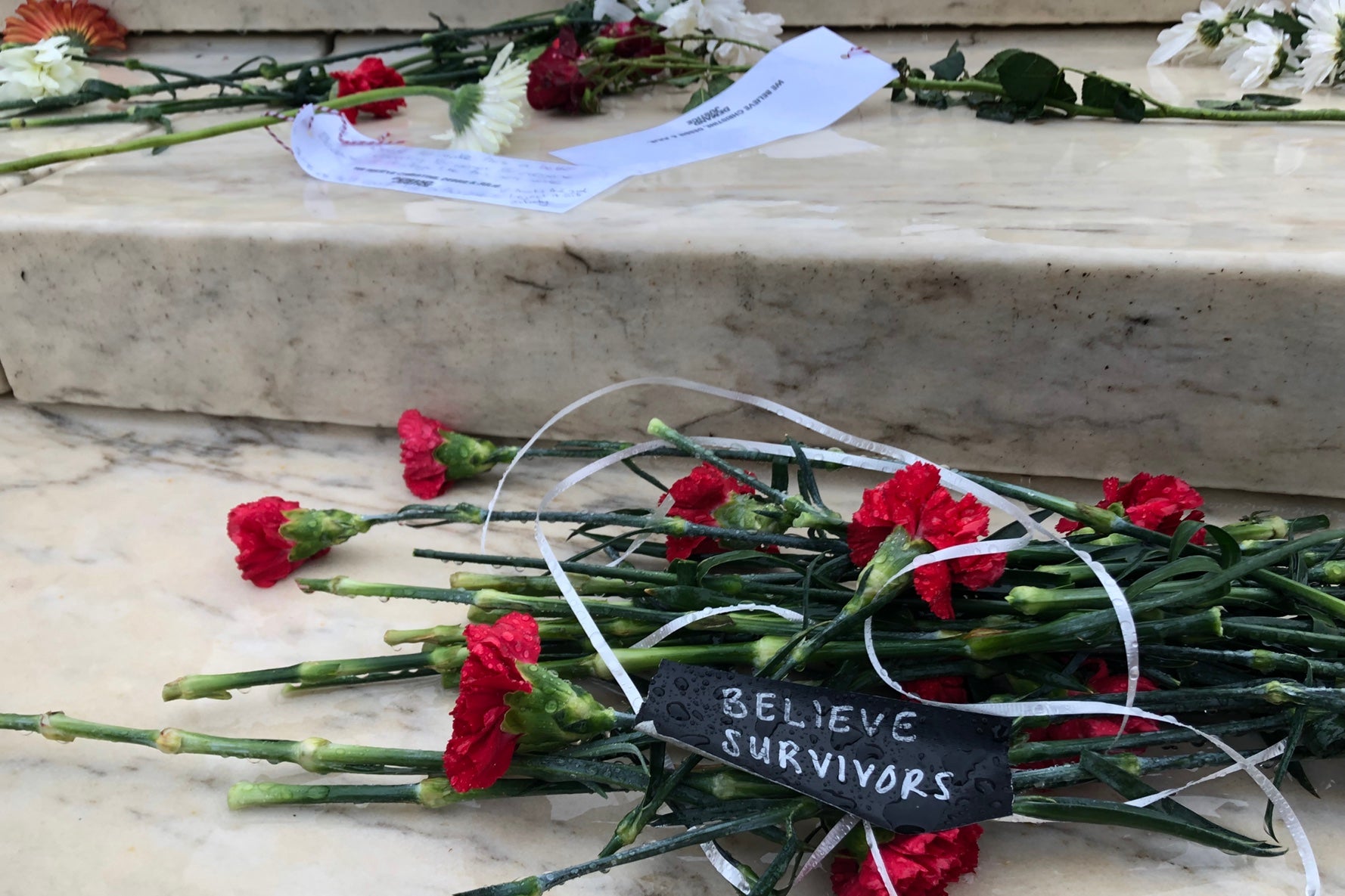 Red and white flowers sprawled across the stairs of the Supreme Court.