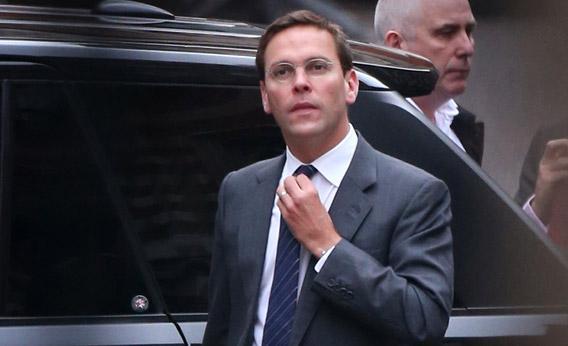 ormer News International chairman James Murdoch adjusts his tie as he arrives at the High Court.