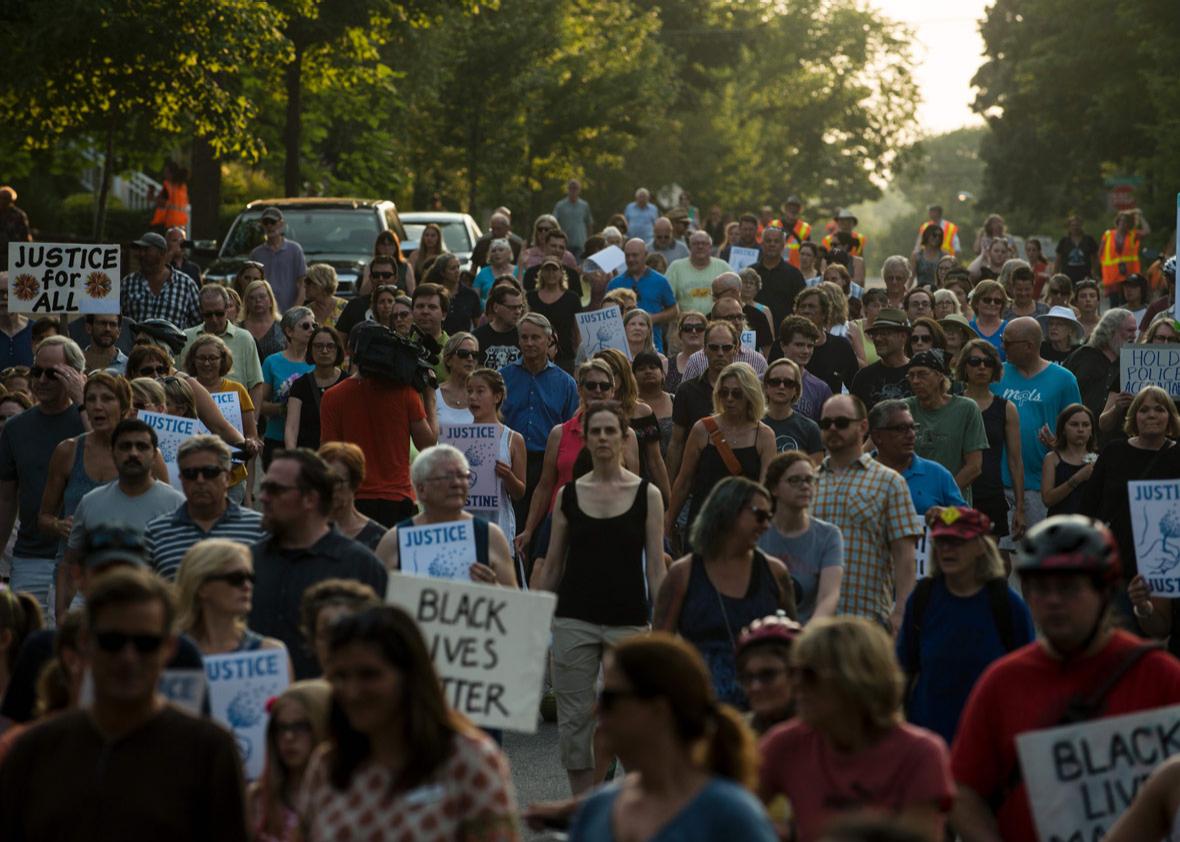 People march down Washburn Avenue on July 20, 2017 in Minneapolis, Minnesota. 