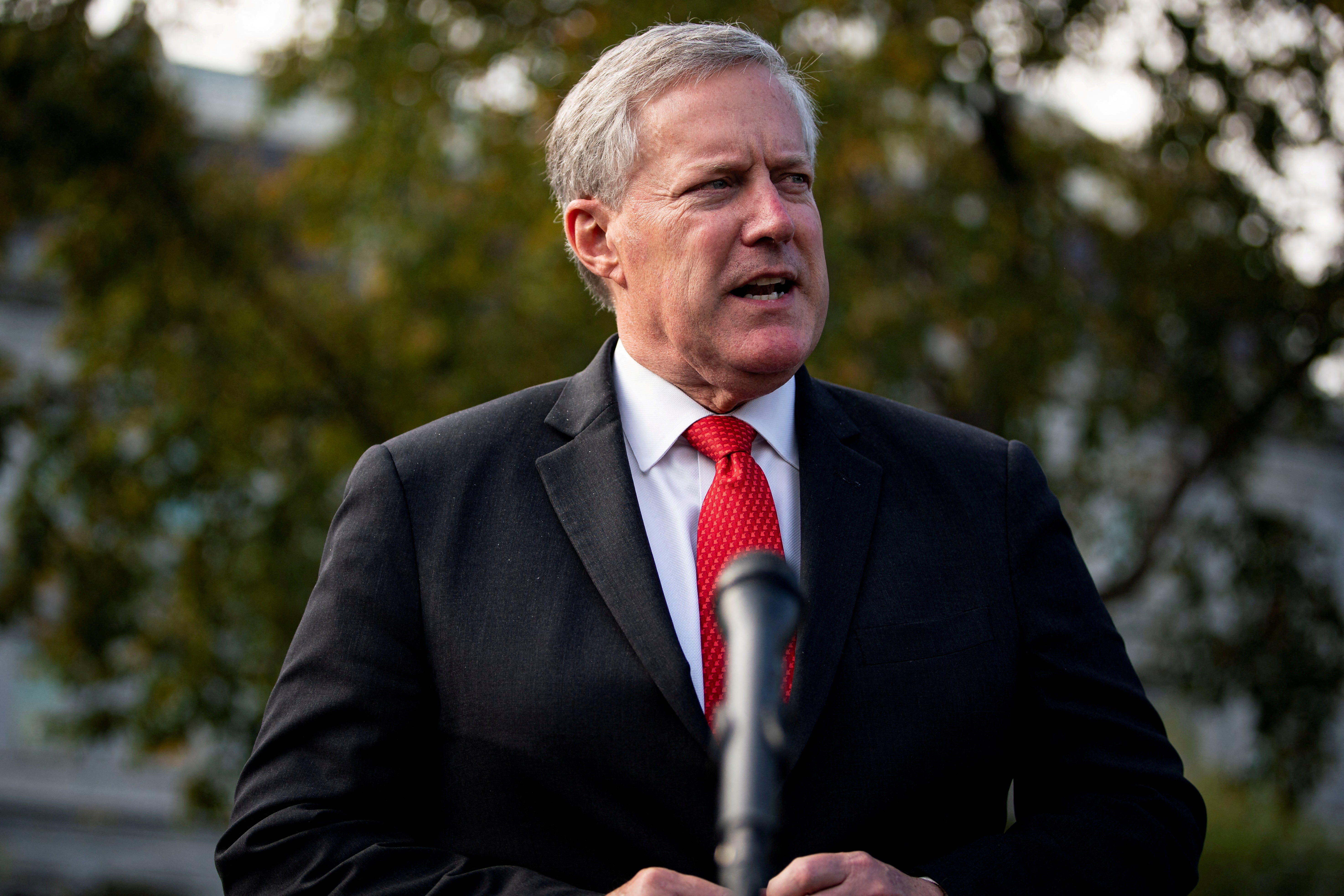 Meadows in a suit speaking at a mic outside the White House