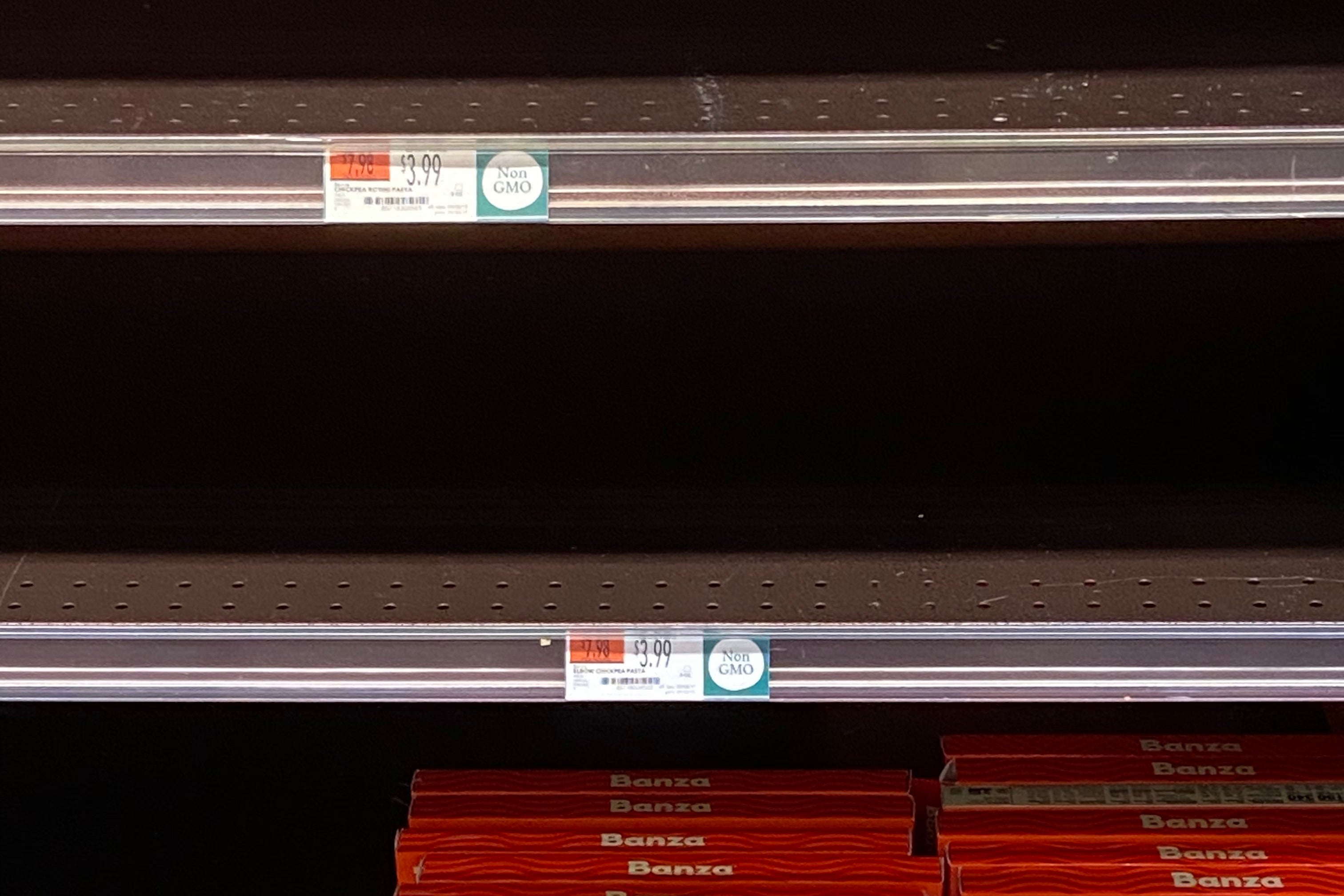 Banza pasta boxes on an otherwise empty shelf.