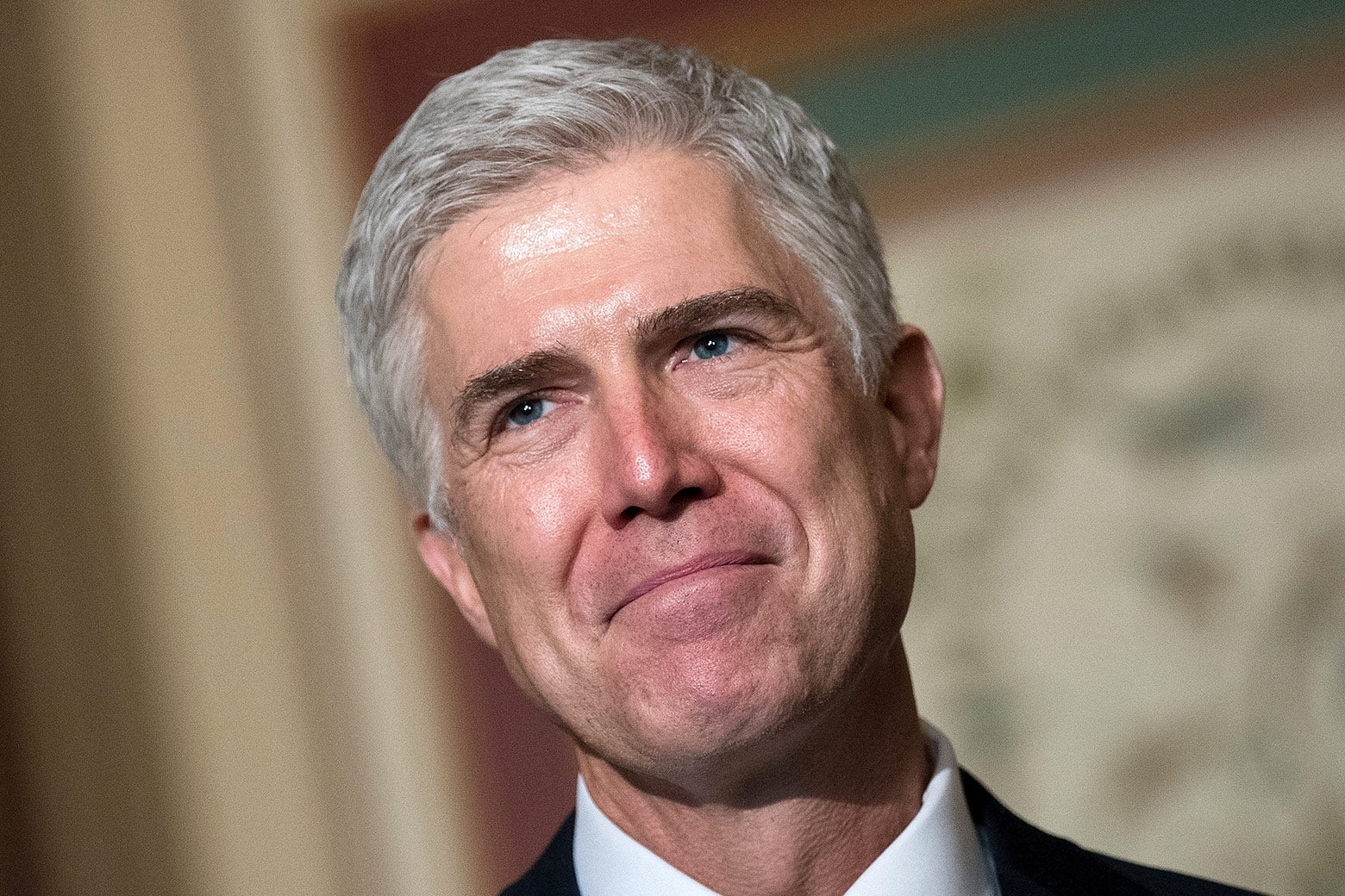 Neil Gorsuch smiles.