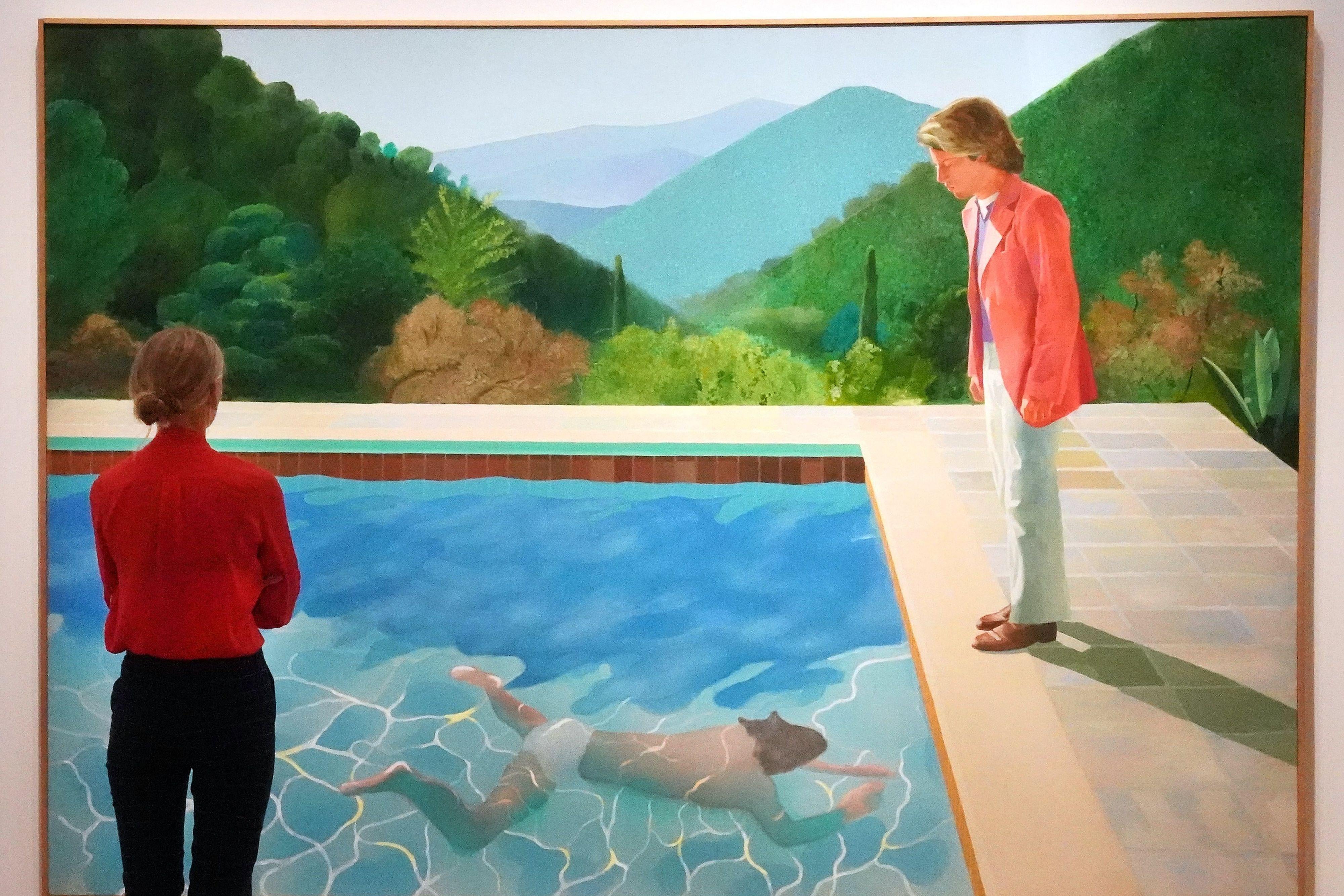 A woman contemplates Hockney's painting 