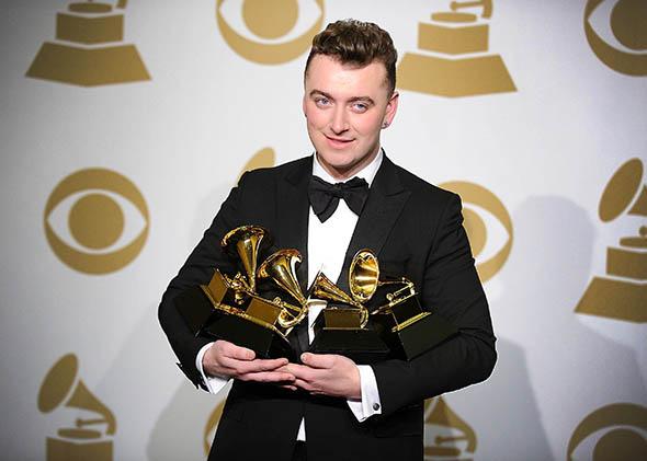 Singer Sam Smith poses in the press room at the 57th Grammy Awards