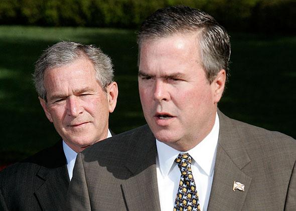 Governor Jeb Bush (D-FL) (R) speaks to the press on the war on terror as his brother U.S. President George W. Bush.