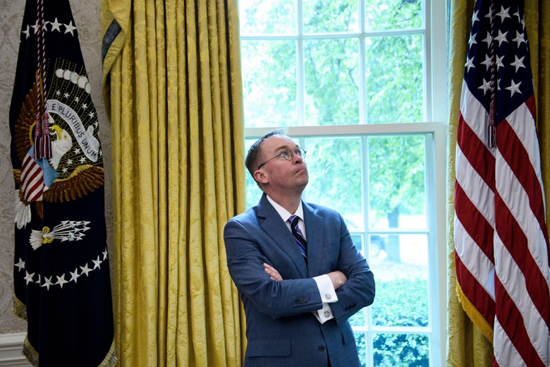 White House acting Chief of Staff Mick Mulvaney listens while US President Donald Trump speaks to the press before a meeting with Hungary's Prime Minister Viktor Orban in the Oval Office of the White House on May 13, 2019, in Washington, D.C.