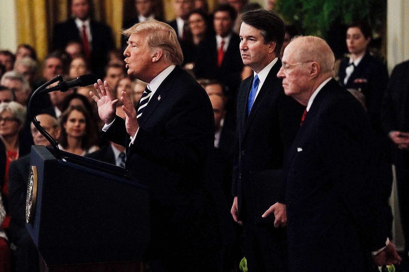 President Donald Trump speaks as Supreme Court Justice Brett Kavanaugh and retired Justice Anthony Kennedy look on during Kavanaugh's ceremonial swearing-in at the East Room of the White House on Monday.