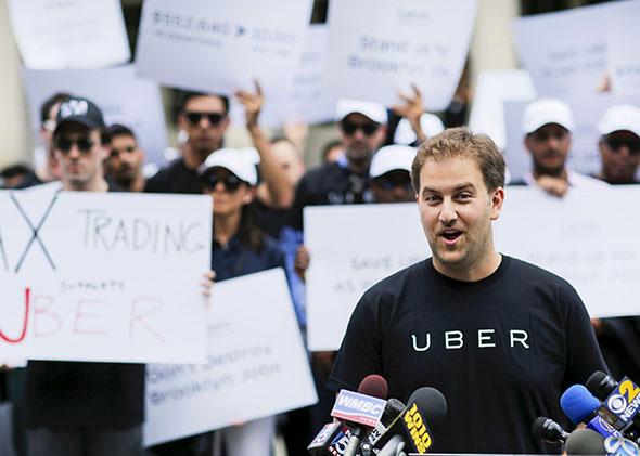 Uber's general manager for New York, speaks to the media while U,Uber's general manager for New York, speaks to the media while Uber riders and driver-partners.