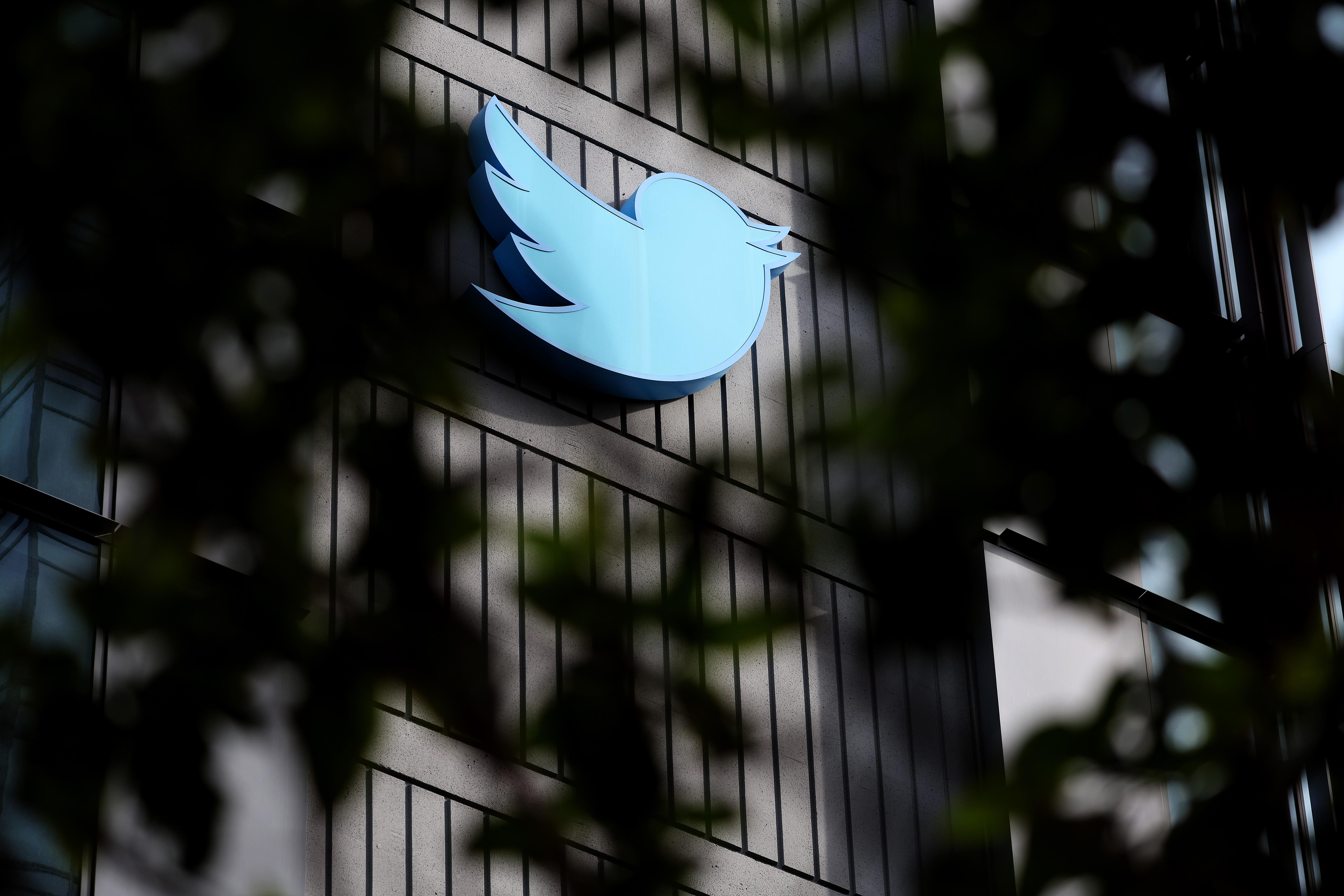 SAN FRANCISCO, CALIFORNIA - OCTOBER 2: The Twitter logo is posted on the exterior of Twitter headquarters on October 28, 2022 in San Francisco, California. Elon Musk closed the deal to purchase social media platform Twitter for $44 billion and has already fired several top executives. (Photo by Justin Sullivan/Getty Images)