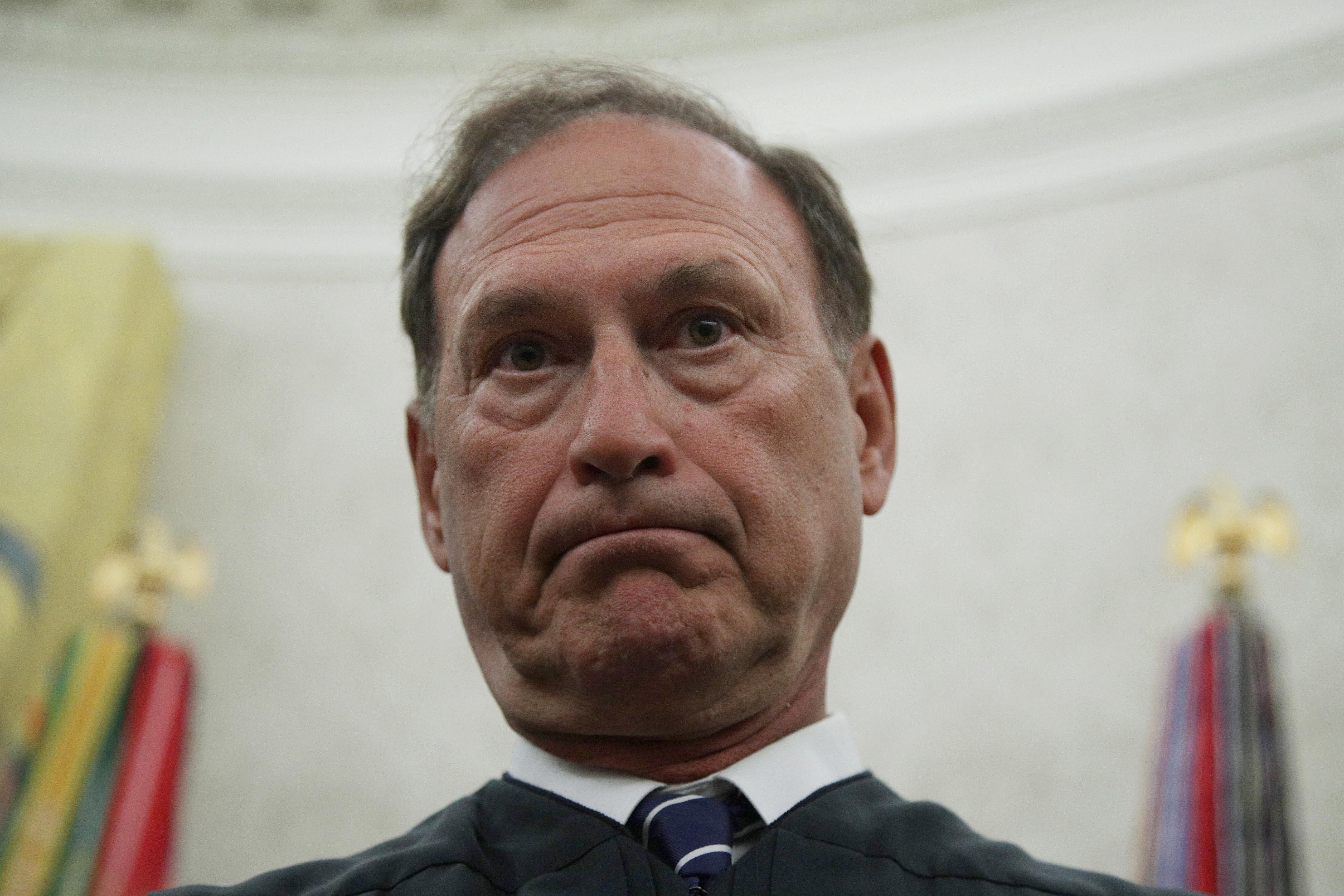 Alito standing in his robes