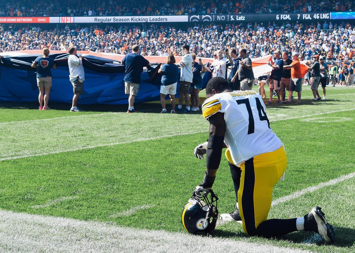 Pittsburgh Steelers offensive tackle Chris Hubbard takes a knee