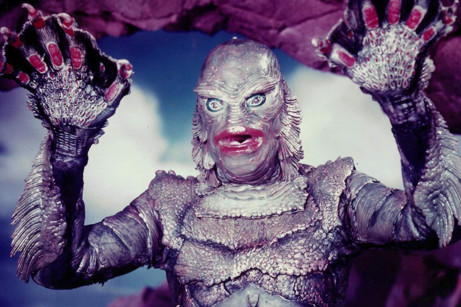 A garish, colorized promotional still of the Creature From the Black Lagoon.
