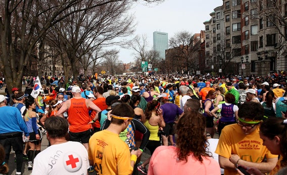 Runners gather near Kenmore Square after two bombs exploded during the 117th Boston Marathon.