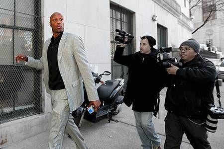 NBA player Lamar Odom arrives to attend a custody hearing.