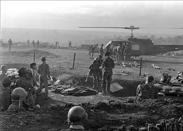 American wounded soldiers of the special forces are evacuated by helicopter from a camp in Plei Me, south Vietnam, November 1965.