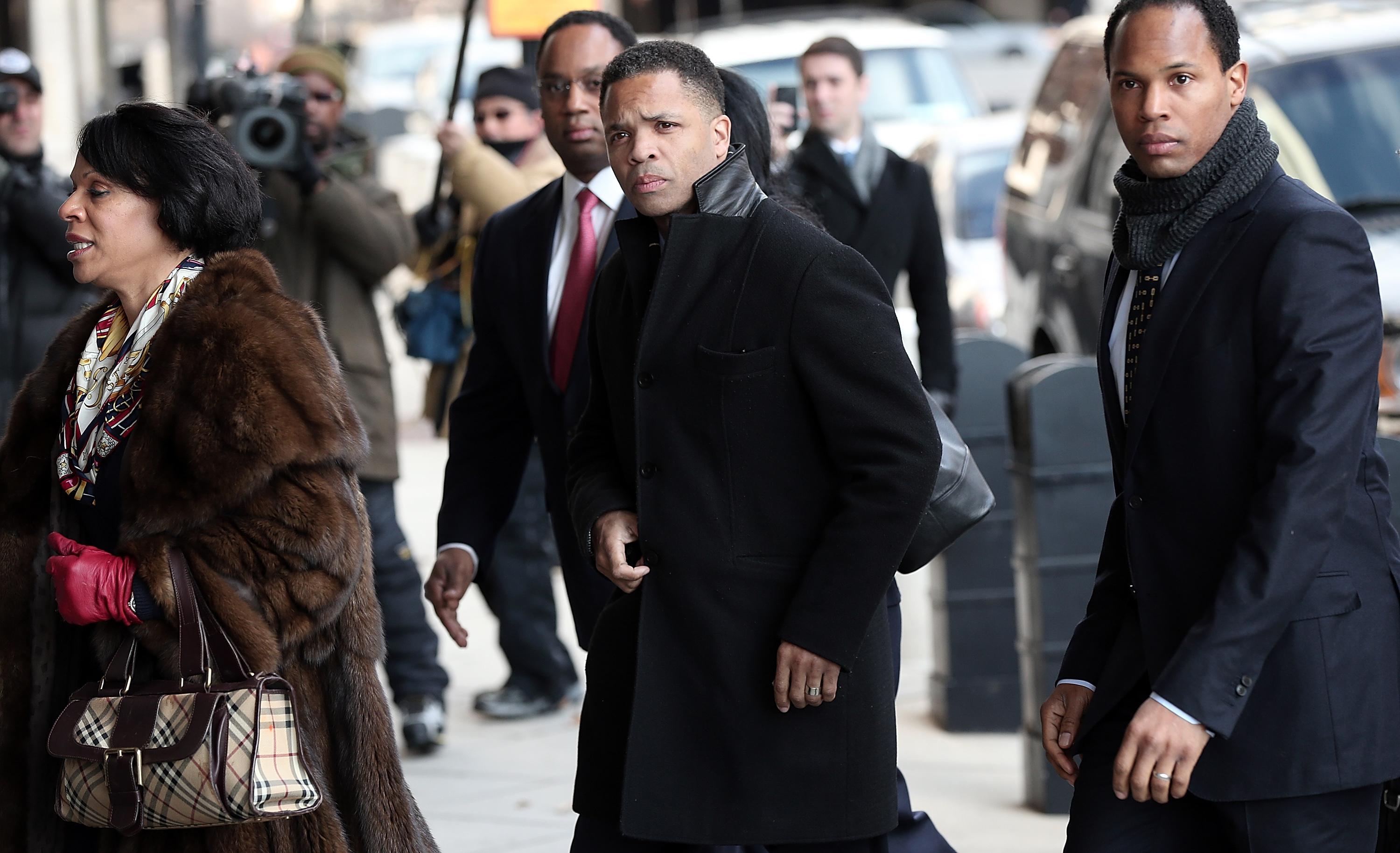 Former Rep. Jesse Jackson Jr. (center) enters U.S. District Court Feb. 20, 2013, in Washington, D.C.